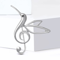 Broche classique en alliage plaqué or moulé sous pression, motif oiseau ajouré et clé de sol, pour la vente en gros de bijoux
