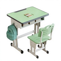 Bureau d'école pour enfants avec chaise, vert clair, bordure blanche, rangement ouvert et hauteur réglable pour une utilisation en classe