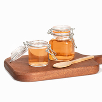 Penjualan laris 100 ml kecil kosong penyimpanan dapur Jam makanan bening kaleng bumbu penyimpanan kaca Mason Jar dengan tutup atas klip kedap udara