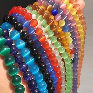 Cuentas de cristal de ojo de gato lisas redondas sueltas de selenita sintética tratada de alta calidad para la fabricación de joyas DIY - Product Image 1