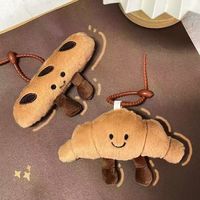 Fabrieksgemaakte croissant knuffel sleutelhangers met aangepast logo, OEM knuffeldieren tascharms, gepersonaliseerde sleutelhangers, promoties, geschikt voor kinderen van 5-7 jaar