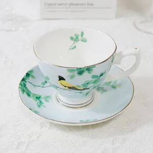 Conjunto de xícara e pires de chá de China osso com padrões de pássaros e flores em estilo chinês, venda direta da fábrica