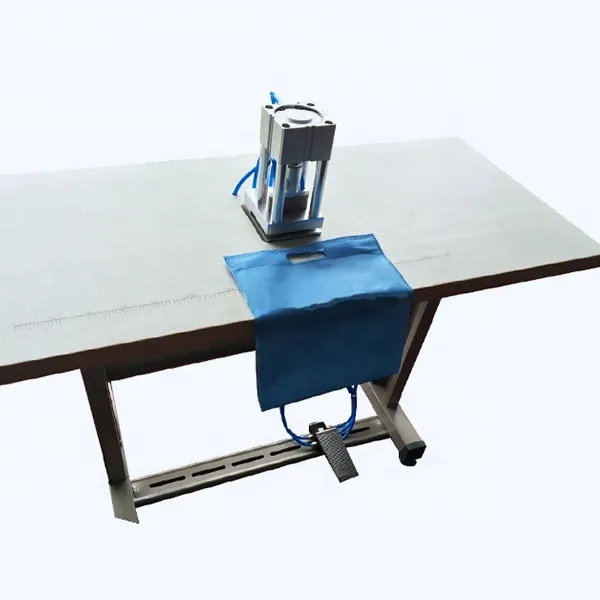 Taurus manual non woven bag making machine price non woven bag d-cut punching machine