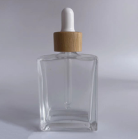 Flacon compte-gouttes en verre transparent carré pour cosmétiques fantaisie de 30 ml, 50 ml, 100 ml avec pipette en bambou
