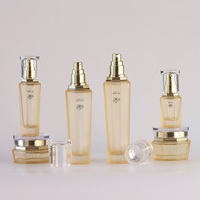Set Kemasan Perawatan Kulit kaca kosong kustom mewah Set botol Losion Matte selesai Krim Serum Diffuser tutup sekrup cetak layar