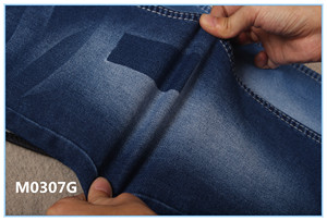 Doble desgaste denim Pantalones vaqueros de tela de peso ligero de alta calidad costo eficaz y mejor venta - Product Image 6