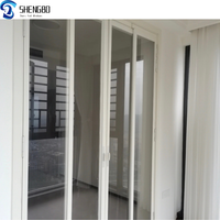Porte coulissante design moderne à double porte en acier PVC insonorisée et coupe-vent pour l'extérieur/l'extérieur Type de persienne pour terrasse intérieure