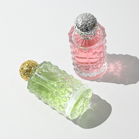 Fabricant de flacons de parfum ronds vides personnalisés OEM à faible MOQ, flacon de parfum en verre transparent pour femmes de 50 ml et 100 ml avec emballage en boîte