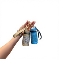 Nouveau style de luxe léger pour influenceurs, porte-clés pendentif pour femme en PU haut de gamme, incrusté de diamants, avec pochette à monnaie portable et pochette rouge