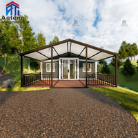 Maison conteneur préfabriquée pliable et extensible à panneaux sombres avec grande véranda, cabane spacieuse pour invités, idéale pour les vacances dans le jardin