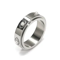 Bague tournante élégante en acier inoxydable noir brossé avec incrustation de petites perles, bijou de mode quotidien pour femme