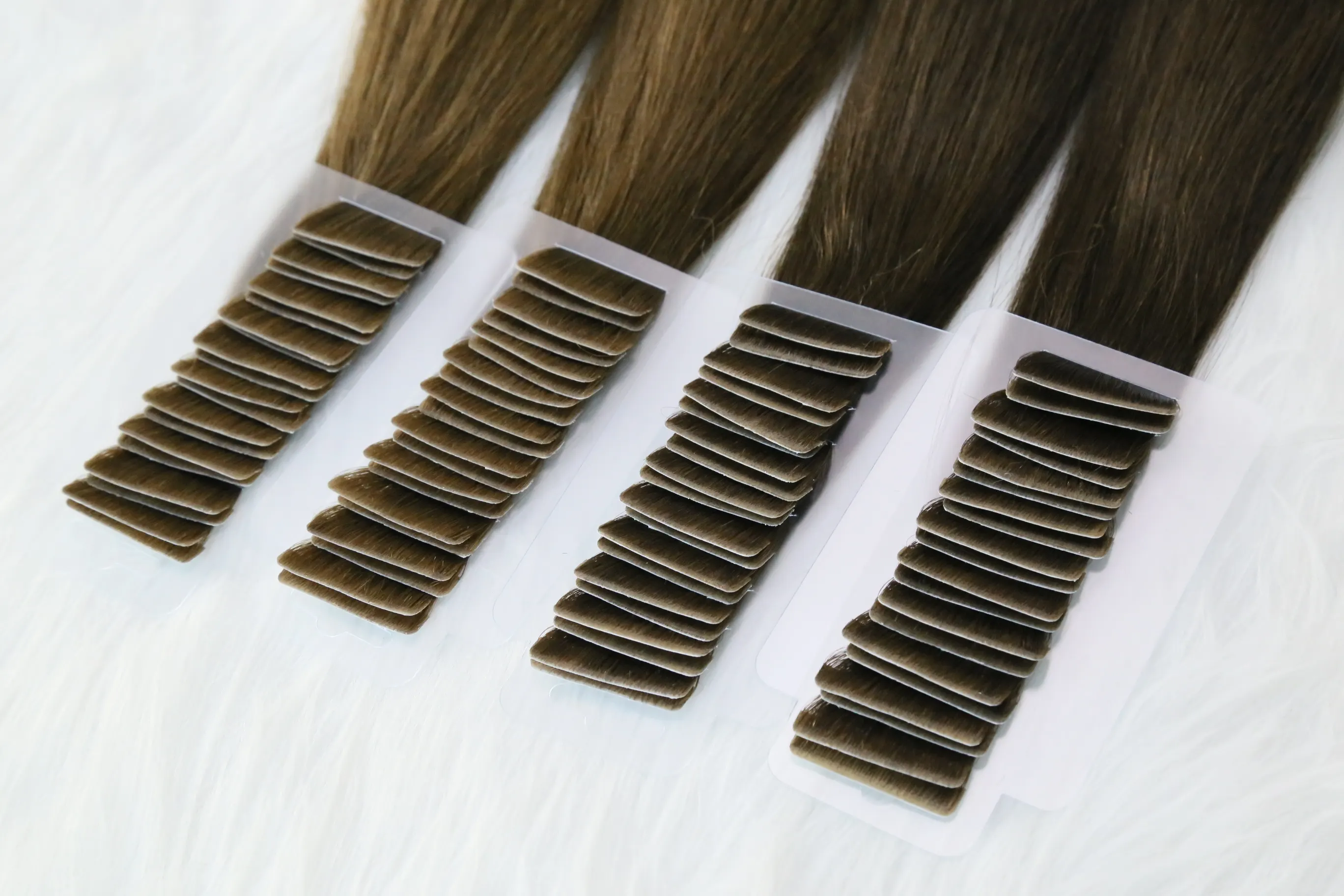 Natuurlijke Huid Inslag Dubbel Getekend Onzichtbare Menselijke Tape Haarverlenging Europees Remy Haar Hand Gebonden Tape In Haar