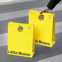 Emballage de vêtement avec logo personnalisé le plus vendu avec poignée trouée sac d'expédition personnalisé réutilisable et écologique