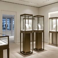 Vitrine de présentation de bijoux autoportante en verre trempé avec finition bronze et éclairage LED, dimensions personnalisables pour le commerce de détail de luxe