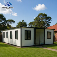 Casa Contenedor Expandible con Marco Blanco y Negro, Estudio Moderno para Jardín, ADU Prefabricada para Patio Trasero con Baño Completo y Calentador de Agua sin Tanque