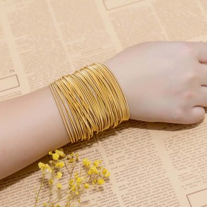 Bracelets en spirale en acier inoxydable plaqué or pour femmes, vente en gros, bijoux fantaisie en forme <span class=keywords><strong>de</strong></span> cordes <span class=keywords><strong>de</strong></span> <span class=keywords><strong>guitare</strong></span> - Product Image 1