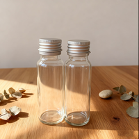 Botella de jugo de vidrio transparente vacía de 50ml con rosca continua Anillo de tapón de rosca de agua Botellas de disparos de molinillo de vidrio redondo largo y delgado