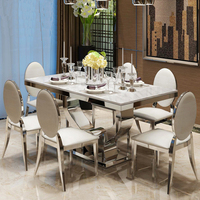 Table à manger rectangulaire en acier inoxydable argenté de luxe français avec plateau en marbre sans 6 chaises, design moderne pour utilisation en restaurant
