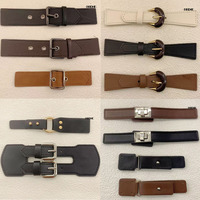Accessoires vestimentaires en cuir tendance avec boucle à fermoir métallique et boutons de fabricant