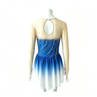 Robe de patinage et de danse dégradé bleu roi pour enfants et adultes, avec manches longues en maille nude et découpes ornées de strass dorés, pour concours et spectacles de patinage artistique
