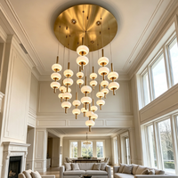 Lustre moderne de grande taille pour hall de villa, luminaires de luxe sur mesure en or, base en laiton, lampes suspendues rondes en marbre et albâtre pour salon