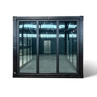 Rumah Kontainer Modern Rakitan Siap Pakai Rangka Hitam Pintu Geser Kaca Besar Kabin Modular untuk Kantor
