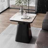 Table basse compacte de luxe léger avec plateau en pierre et structure en fer, design moderne et créatif pour salon