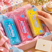 Jouet Squishy en forme de beurre en boîte avec texture de glace pilée visible et rebond lent