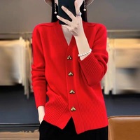 Cardigan tricoté de couleur unie de nouveau design pour les femmes portant un pull ample de style simple à manches longues