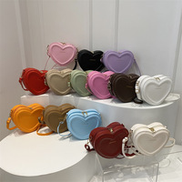 Sac à bandoulière en forme de cœur tendance, couleur bonbon, petit sac à bandoulière pour fille, sac à bandoulière décontracté en cuir PU avec fermeture éclair pour femme