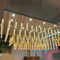Lustres modernes de luxe pour escalier en verre, luminaires suspendus au plafond, luminaires suspendus en forme de goutte de pluie, lustres LED