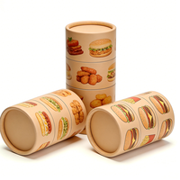 Emballage en tube cylindrique en carton écologique fait main à motif burger et frites, avec matériaux recyclés pour la restauration rapide et les collations