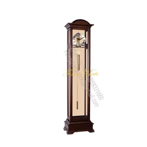 The glass and metal construction of this pendulum grandfather clock imparts contemporary style to your living room