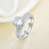 Fournisseur de bijoux haut de gamme QX, bague en or fin et argent sterling 925 avec pierre principale en forme de poire sertie d'un halo et de deux rangées de pierres fines