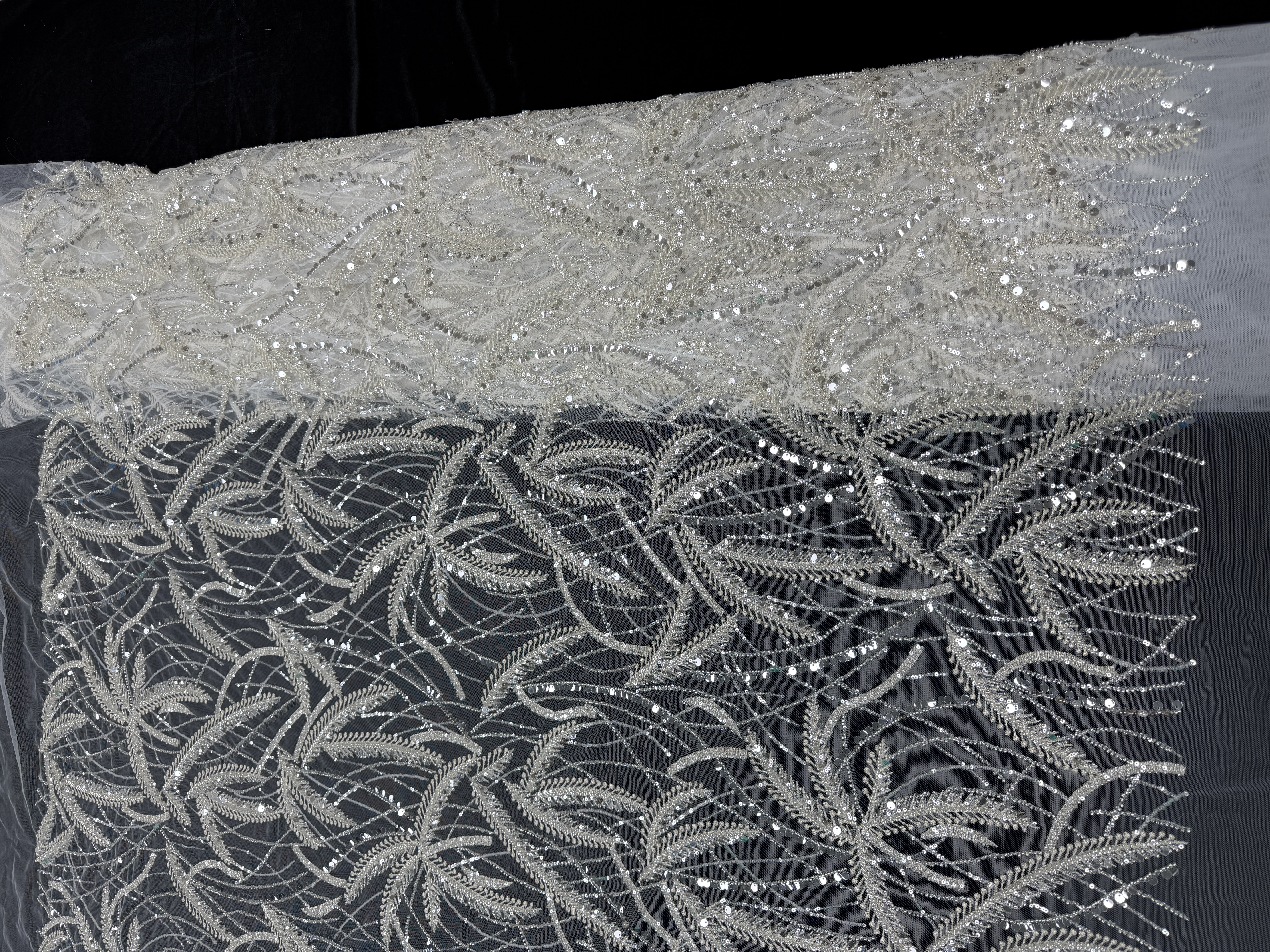 White mesh fabric paired with silver beads