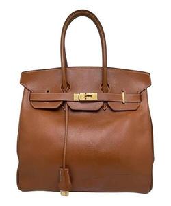 Sac à main tendance pour femme en similicuir avec détail pompon, fermeture éclair sécurisée, deux poignées, intérieur spacieux, sac de mode pour le shopping - Product Image 1