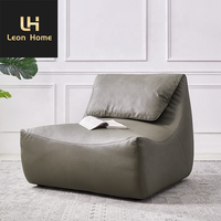 Mobilier de salon italien moderne et léger et luxueux Chaise longue de loisirs en cuir avec repose-pieds