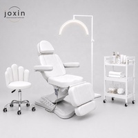 Lit de massage moderne avec accoudoirs, lit cosmétique, lit de massage électrique de luxe pour soins du visage, idéal pour esthéticiennes et spas médicaux