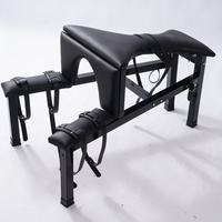 Chaise de bondage BDSM noire pour positionnement et maintien, avec fonction d'orgasme forcé et de fessée, équipement de bondage