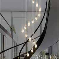 Lustre en cristal rotatif de luxe pour l'installation de suspension d'escalier de villa