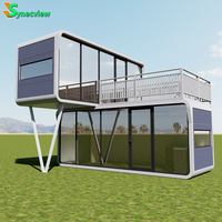 Maison préfabriquée de luxe de 20 pieds 40 pieds avec 2 chambres à coucher Maison modulaire en acier léger Cuisine Design en verre Maison à capsule capsule pour villa de luxe