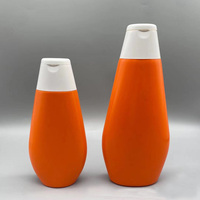 Emballage cosmétique pour soins de la peau, flacon en plastique HDPE de couleur orange de 200 ml et 400 ml avec bouchon à rabat pour lait corporel et crème