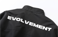 Blouson Bomber à Col Montant Zippé avec Poignets et Ourlet Côtelés, Poches à Rabat, Coupe Ample, Style Streetwear, Noir Uni, Vente en Gros Personnalisable