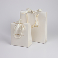 Sacs cadeaux luxueux en papier épais mat rose clair personnalisables SUNNY PACK avec poignée pour boutique de bijoux