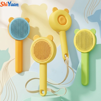Brosse démêlante SHIYUAN en acier inoxydable pour chats et chiens, peigne à picots souples, outil de toilettage pour animaux, auto-nettoyant, pour une élimination facile des poils.