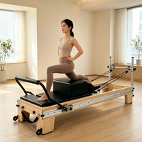 Vente en gros usine : Équipement d'exercice Platis – Reformer Pilates complet en bois d'érable avec poteau en aluminium pour studios de yoga