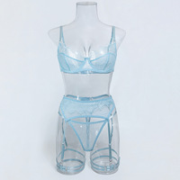 Nouvel ensemble de lingerie érotique populaire en quatre pièces, transparent et ajouré, en dentelle pour femme