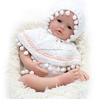 Poupée bébé fille réaliste 22 pouces Silicone souple et corps lesté Reborn Baby Dolls jouet de dessin animé de mode