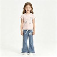 Ensemble décontracté 2 pièces d'été de haute qualité en gros : T-shirt blanc à manches courtes orné de strass papillon + Jean évasé à bordure en dentelle