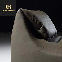 Mobilier de salon italien moderne et léger et luxueux Chaise longue de loisirs en cuir avec repose-pieds